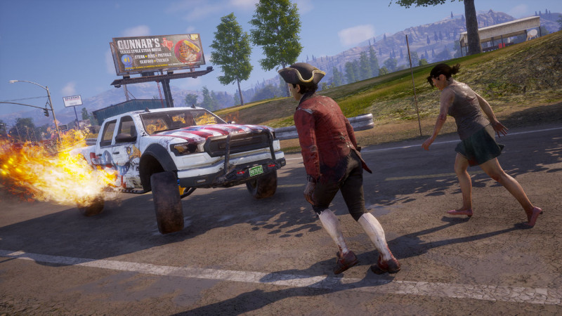 A zombie in a tricorn hat is about to get creamed by a red, white, and blue truck.